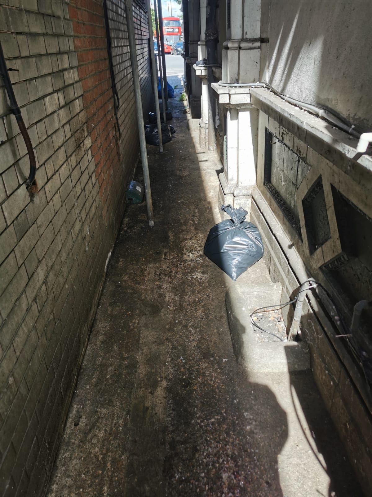 The same alley after clearing, swept and clean